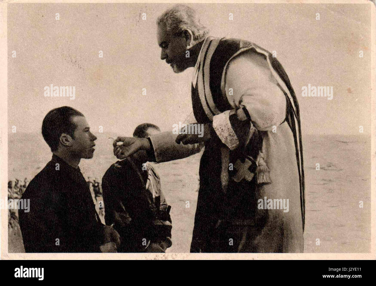 This reference relates to an event in Ethiopia in 1936 involving the communion of soldiers or legionaries. The historical context points to the Italian occupation of Ethiopia during the Second Italo-Ethiopian War. Stock Photo