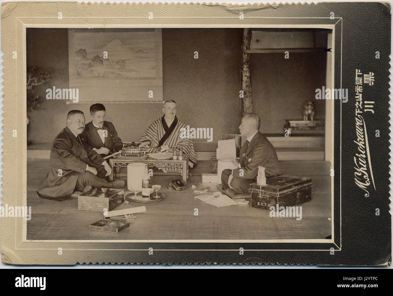 Charles (BCT) Gray in kimono with 3 suited japanese men at Hotel Shimpanlo, Shimonseki ca 1895 Stock Photo