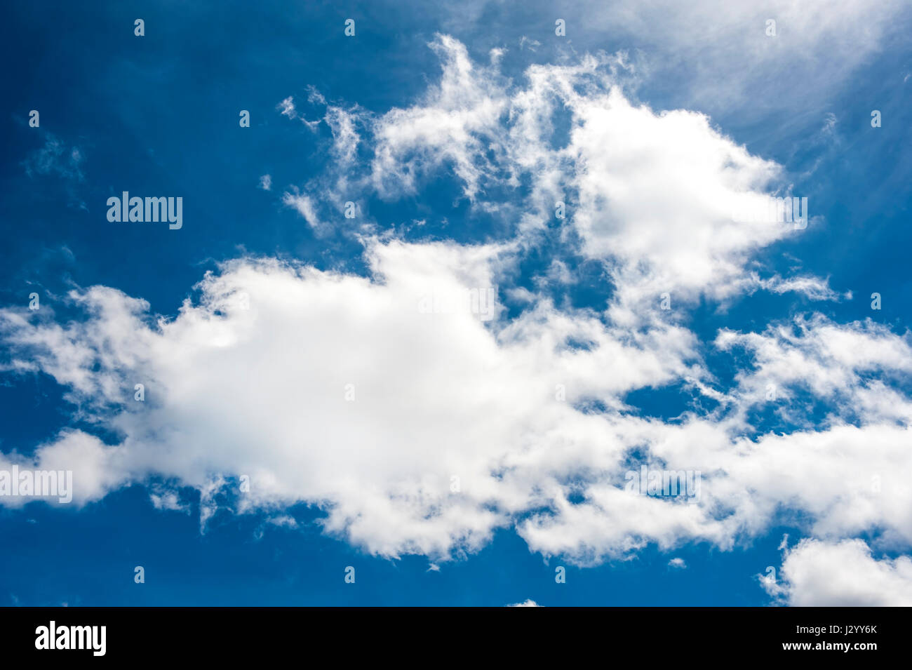 Blue sky with big white cloud closeup Stock Photo - Alamy
