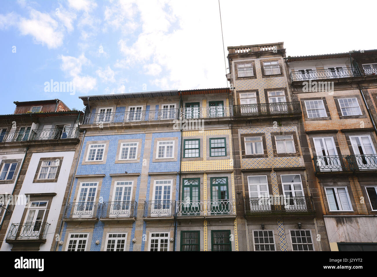 Facades of old colorful different houses in touristic district, Porto, Portugal. Stock Photo