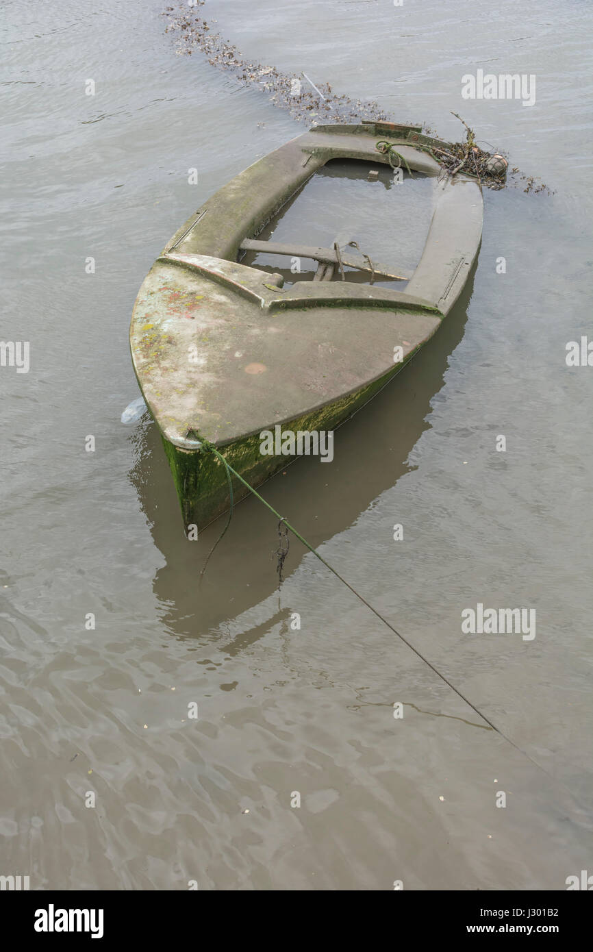 Waterlogged boat as visual metaphor for 'sinking the ship', 'sink the