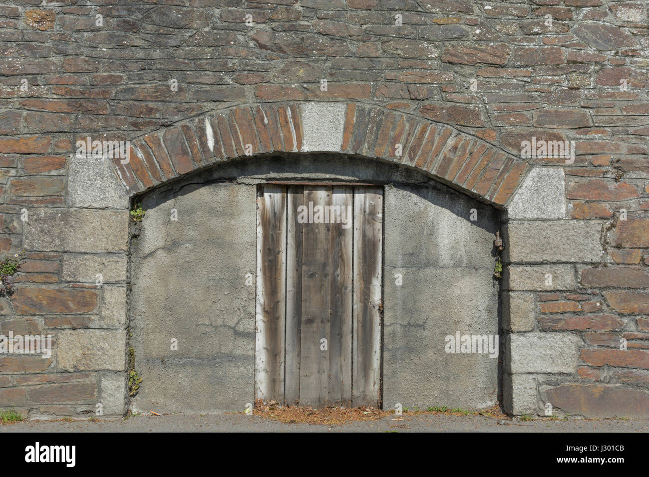 Blocked doorway in arched edifice - possible metaphor for 'barring', blocking, and so on. Stock Photo