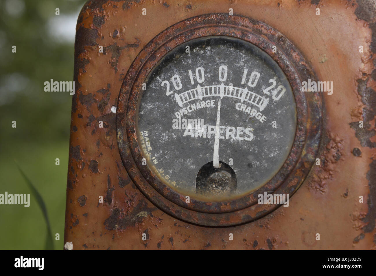 An ammeter gauge on an old tractor. Stock Photo