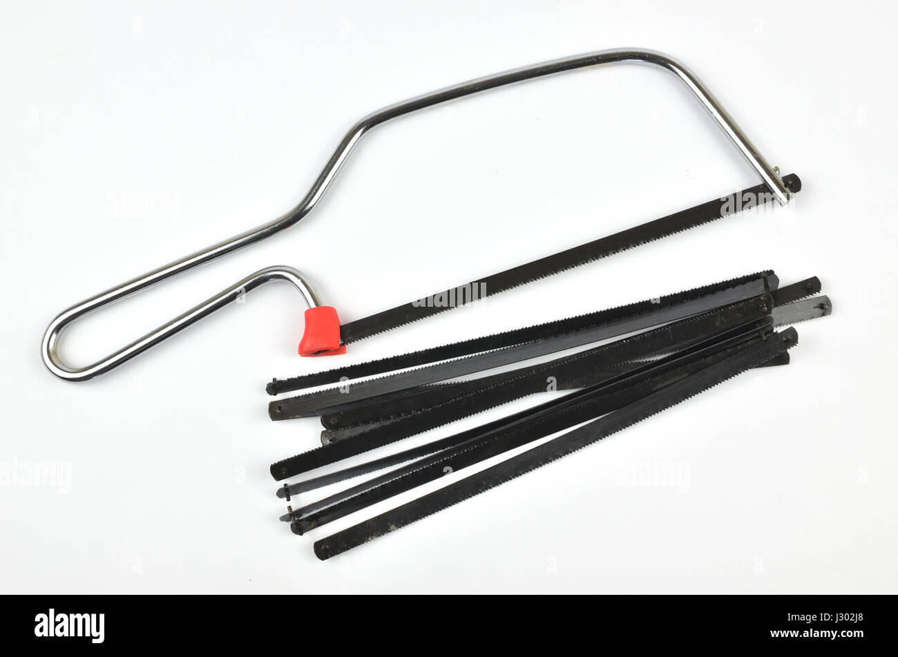 Hand saw with a bunch of blades as spare parts Stock Photo Alamy