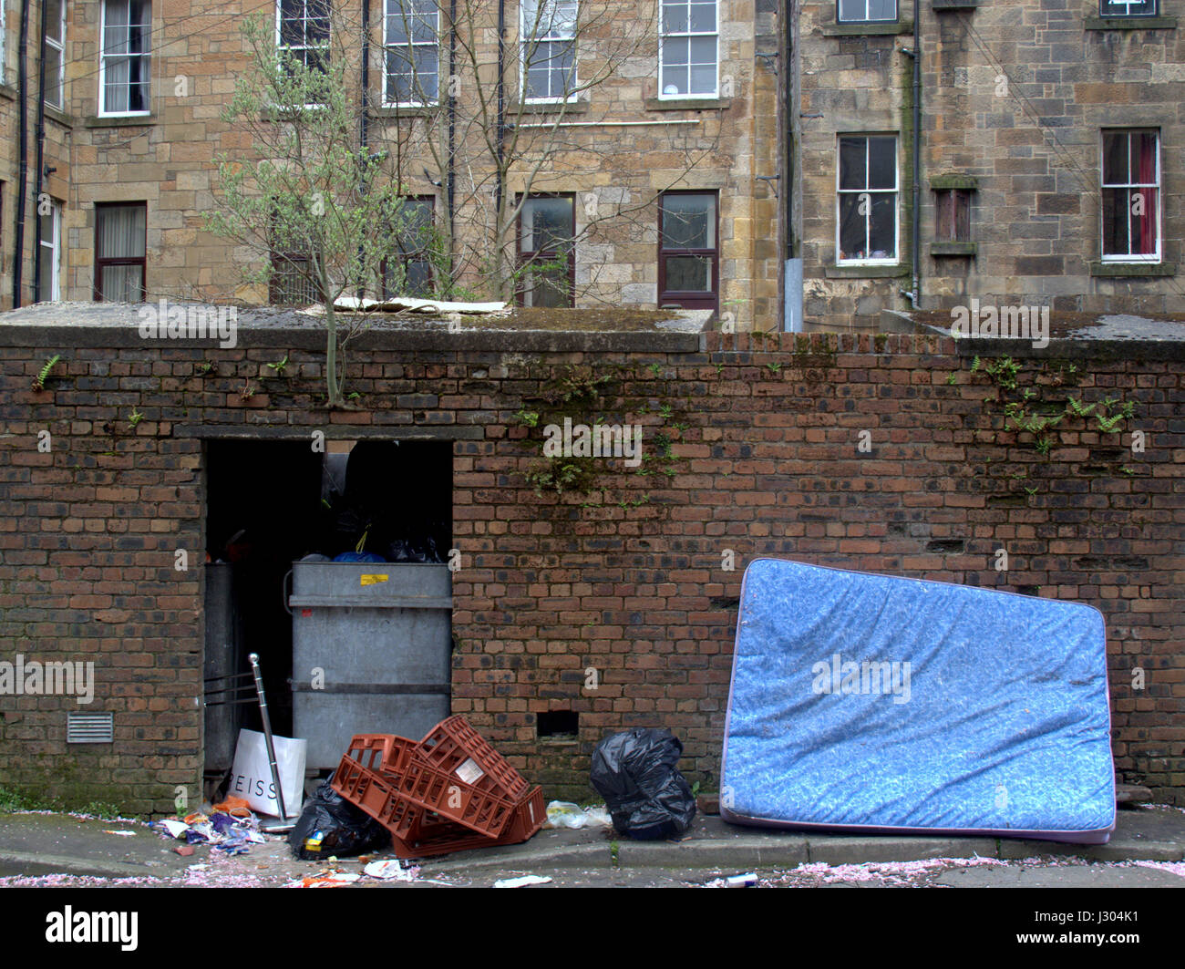 Glasgow park district Fly tipping rubbish garbage rat infested discarded mattress Stock Photo