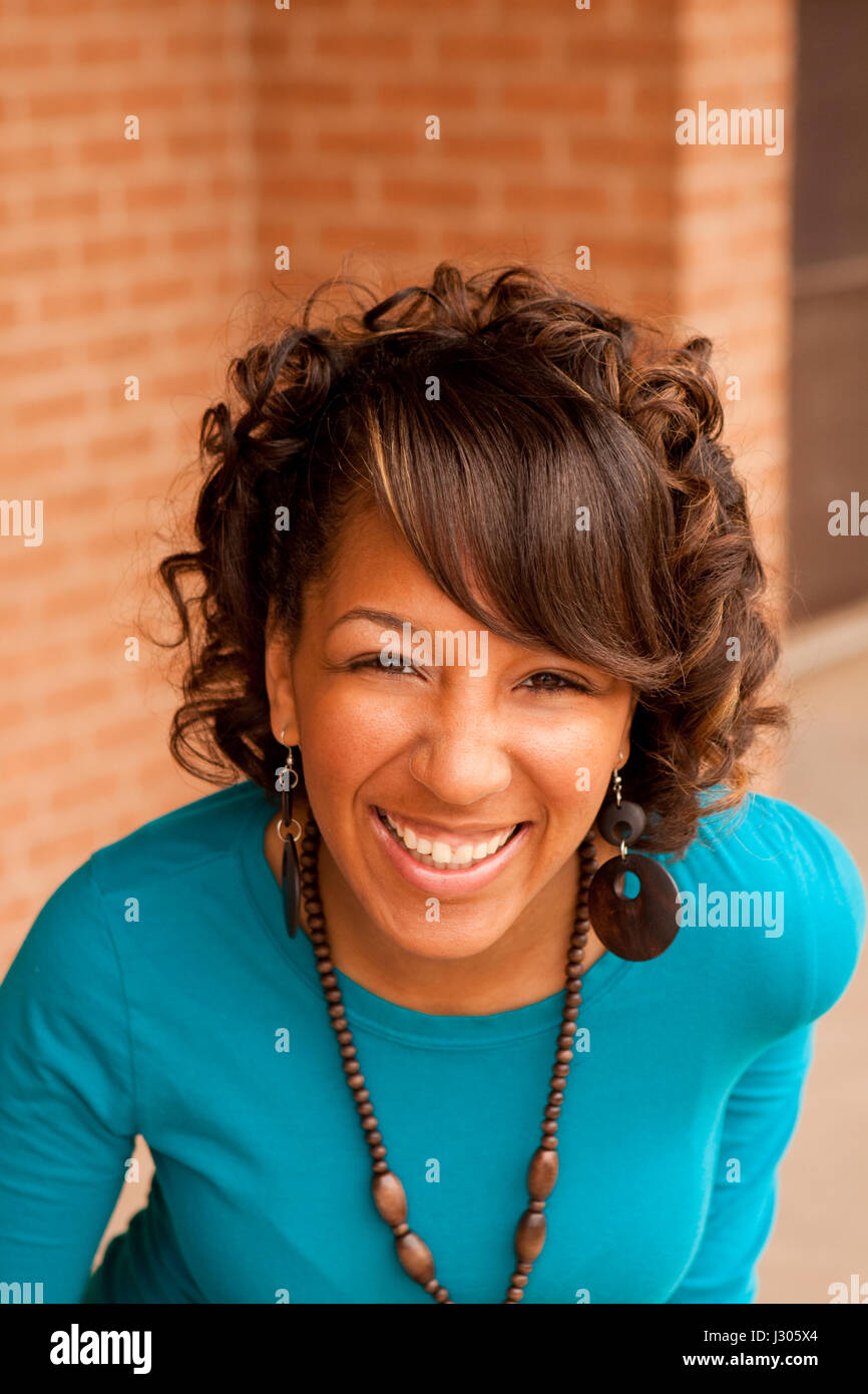 Beautiful young African American woman smiling Stock Photo - Alamy