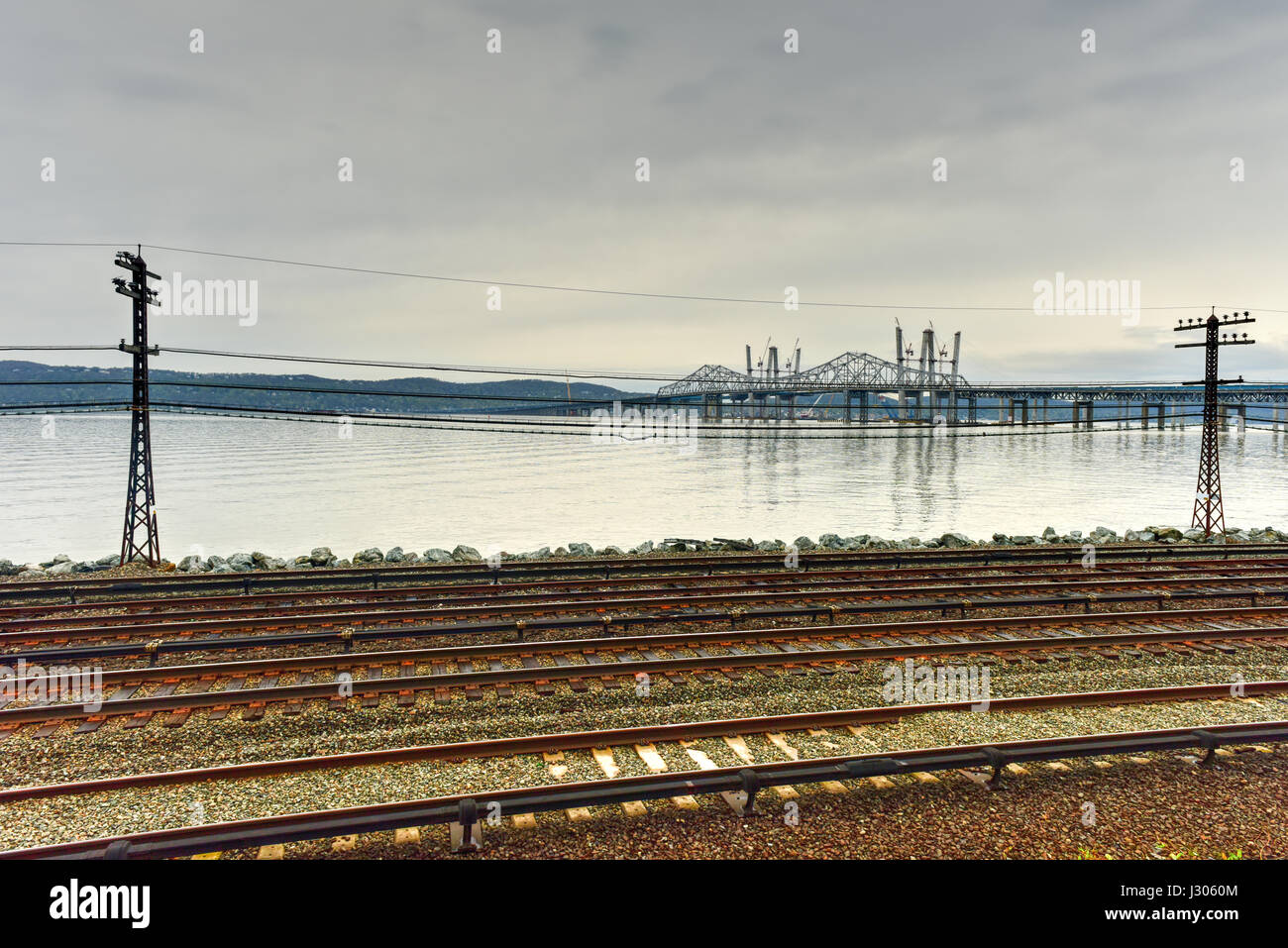 The new Tappan Zee bridge under construction across the Hudson River in New York across train tracks. Stock Photo