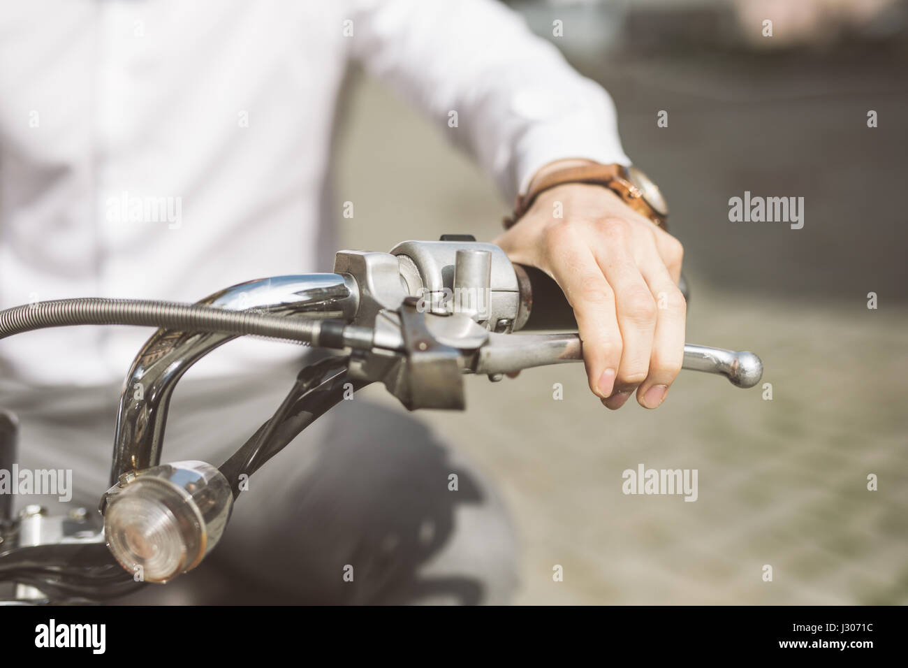 Riding motorcycle, close up of hand on handlebar Stock Photo - Alamy