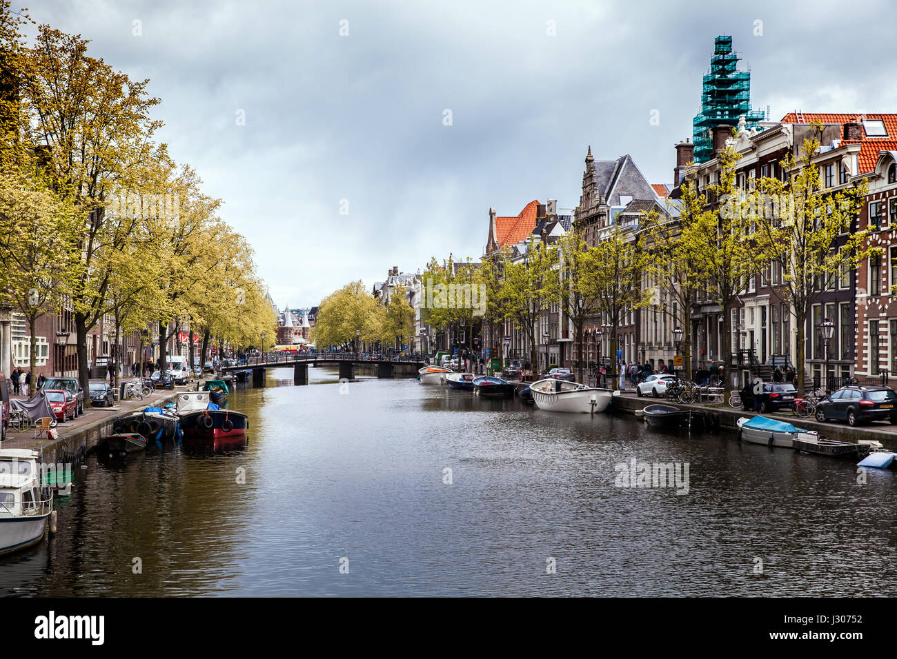 Amsterdam canal view with boats Stock Photo - Alamy