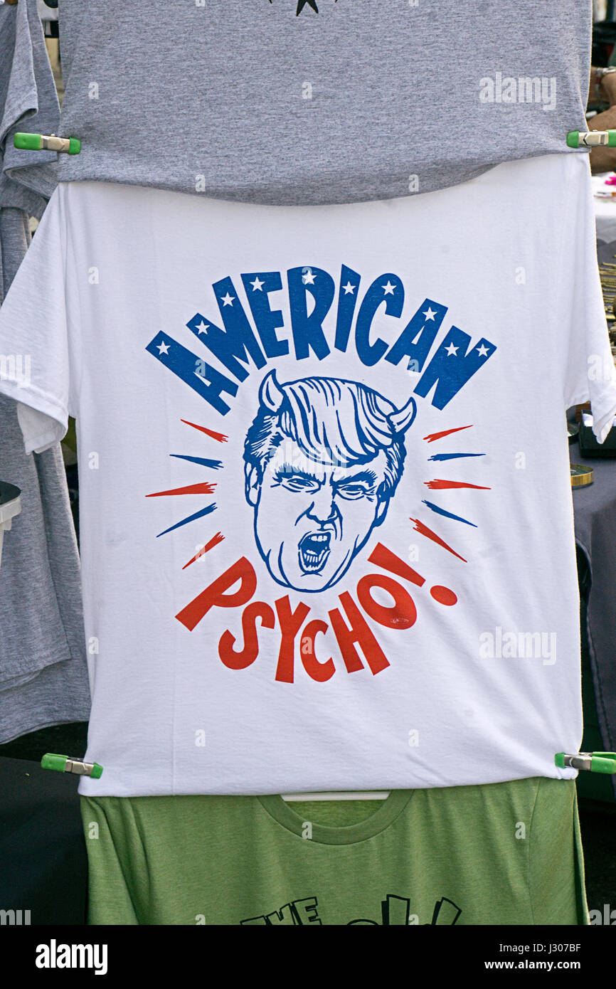 A tee shirt ridiculing President Donald Trump for sale at the Eighth Avenue Street Fair in the Chelsea section of Manhattan, New York City. Stock Photo