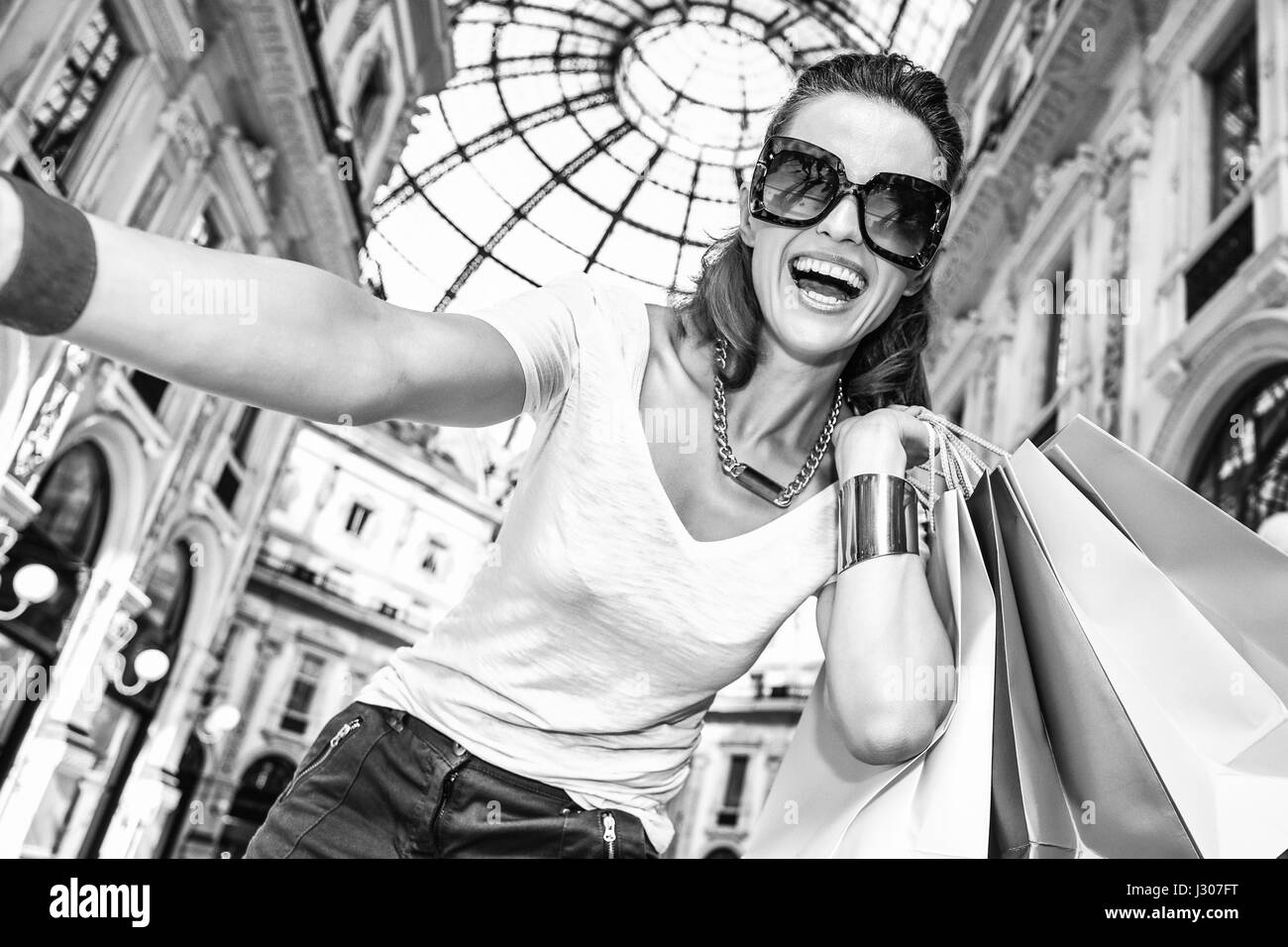 Discover most unexpected trends in Milan. Smiling fashion woman in