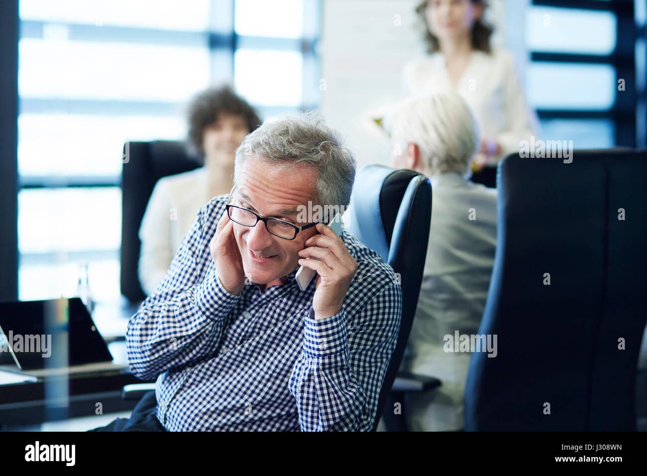 Emergency call on the business meeting Stock Photo