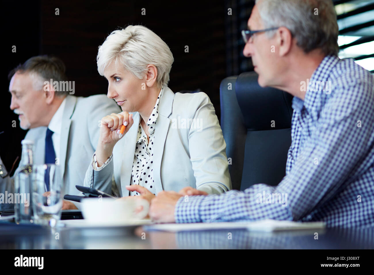 Coworkers carefully listening to presentation Stock Photo