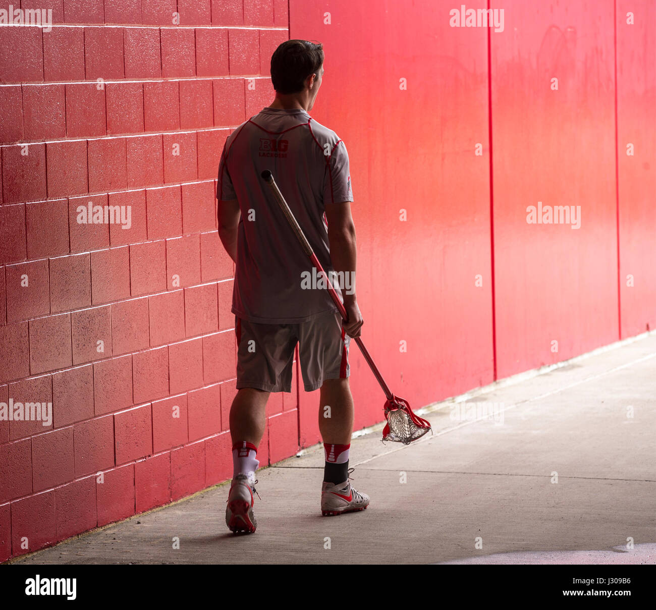 A lacrosse player walking to practice at Rutgers University Stock Photo
