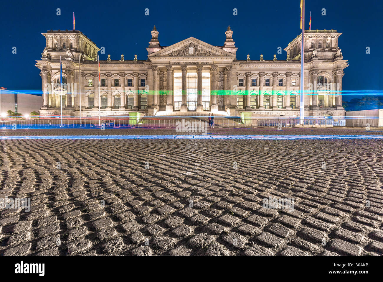 Classic panoramic view of famous Reichstag building, seat of the German Parliament, illuminated in beautiful twilight during blue hour at dusk, Berlin Stock Photo