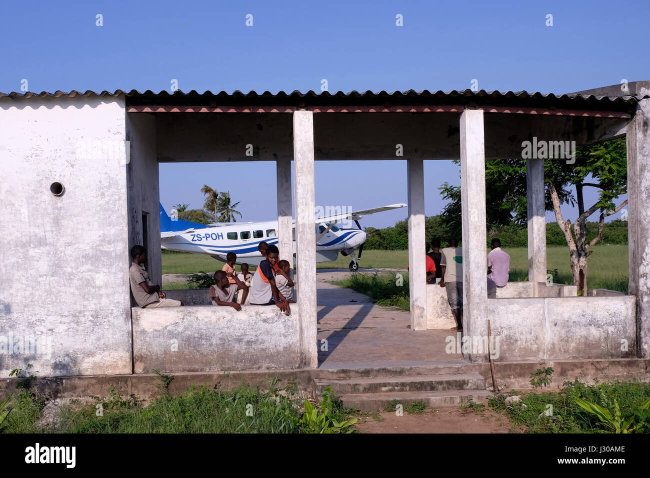Light aircraft at the small grass runway in Ibo island one of the Quirimbas Islands in the Indian Ocean off northern Mozambique Africa Stock Photo