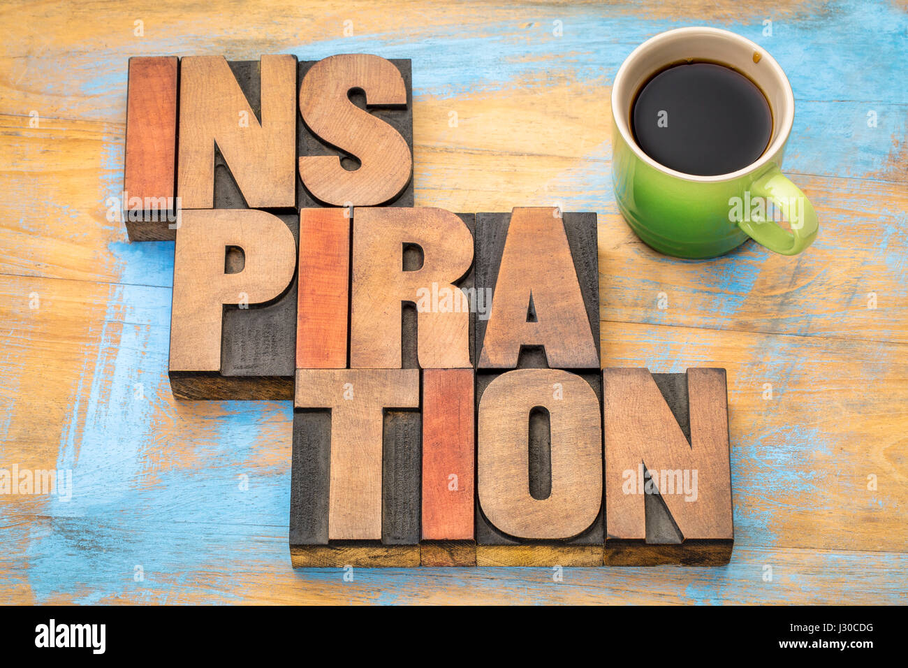 inspiration word abstract in letterpress wood type with a cup of coffee Stock Photo
