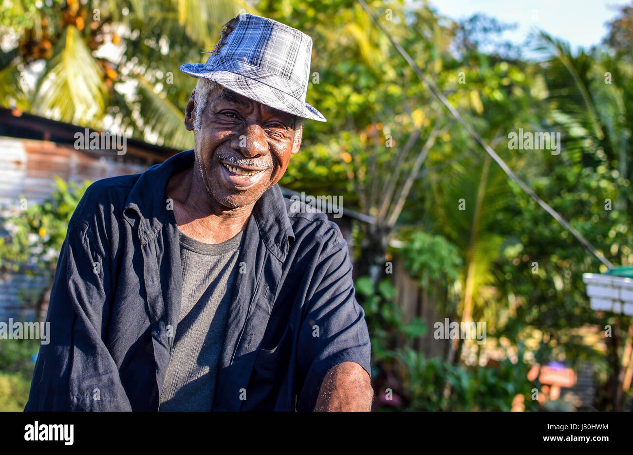Livingston, Guatemala - March 7, 2015: Garifuna man smiles into the camera on March 7, 2015 in Livingston, Guatemala. Garifuna are the group of indige Stock Photo