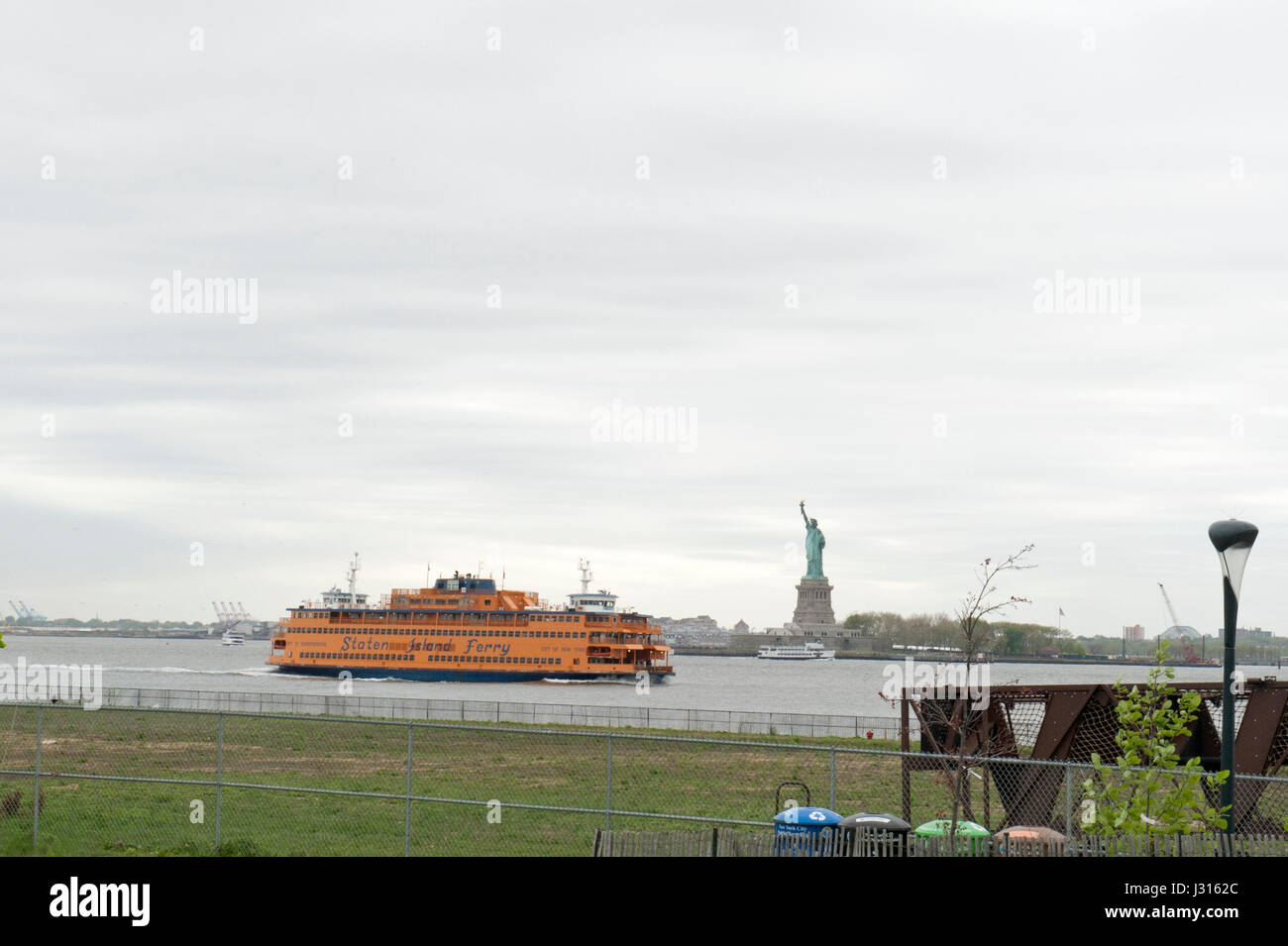 The Statue of Liberty and a Staten Island ferry as seen from Governors