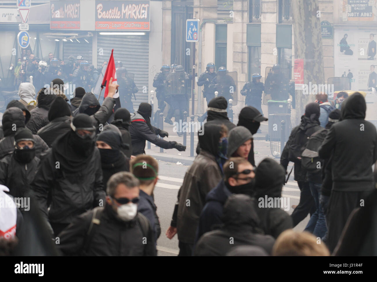 Paris, France. 1st May, 2017. Protester face French anti-riot police during a march for the annual May Day workers' rally in Paris on May 1, 2017. Credit: VWPics/Alamy Live News Stock Photo
