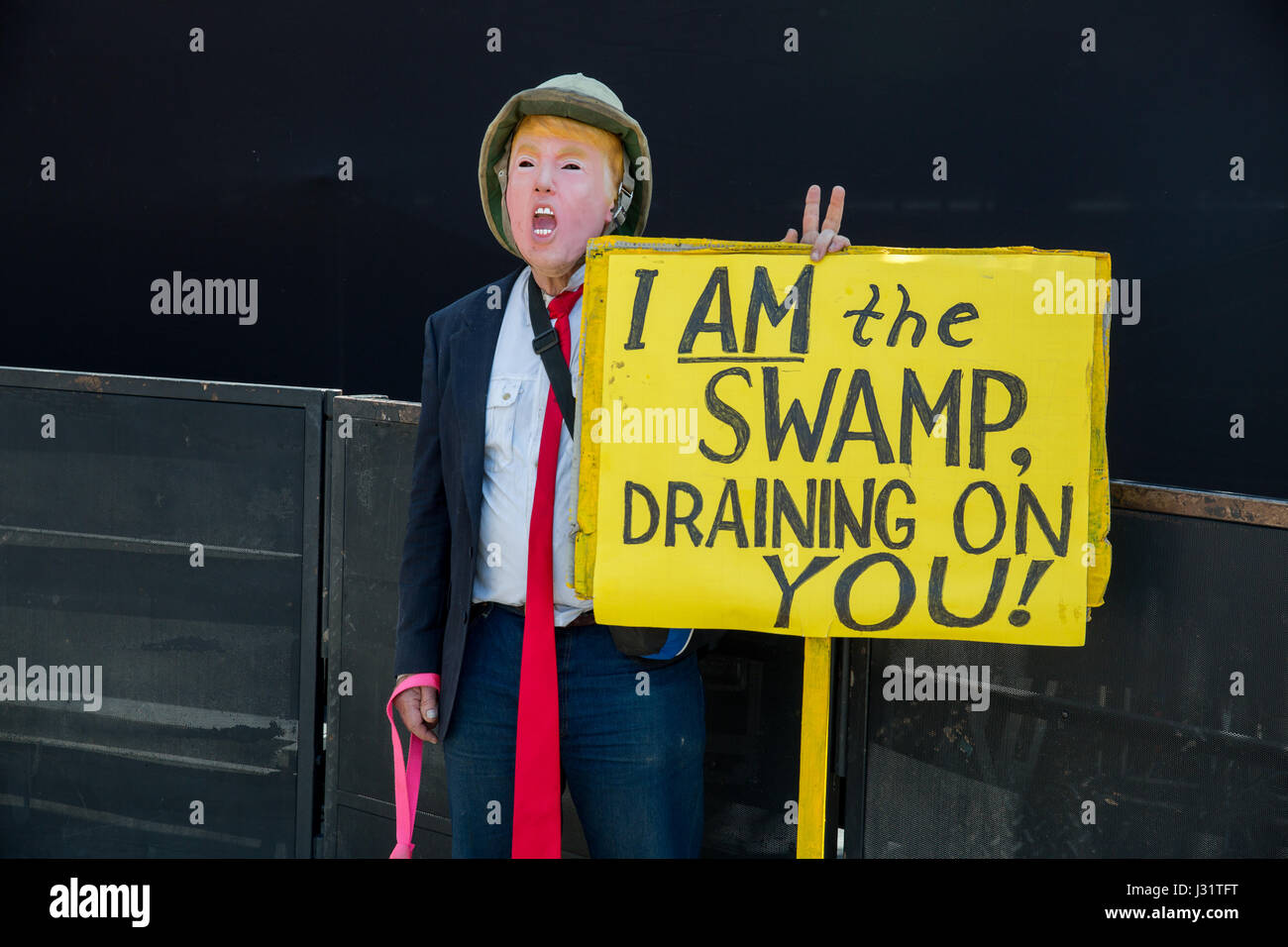 Los Angeles, USA. 1st May, 2017. Protester with sign, wearing Donald Trump mask at May Day rally in Downtown Los Angeles, California, May 1st, 2017. Credit: Jim Newberry/Alamy Live News Stock Photo