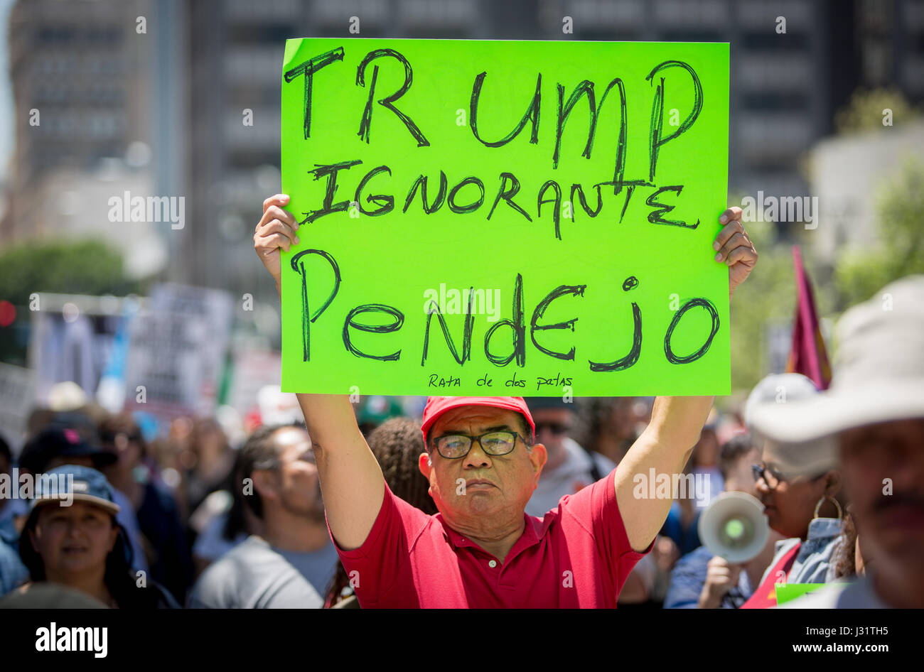 Los Angeles, USA. 1st May, 2017. Anti Trump protester at May Day rally in Downtown Los Angeles, California, May 1st, 2017. Sign reads 'Trump Ignorante Pendejo.' Credit: Jim Newberry/Alamy Live News Stock Photo