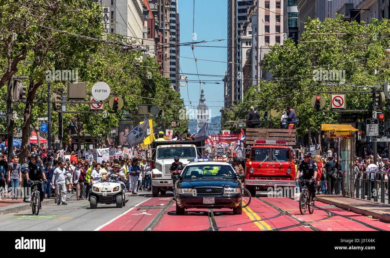 San Francisco, California, USA. 1st May, 2017. Police peacefully lead the march down Market Street on a 'Day Without Immigrants.' On May 1, 2017, more than 40 cities in the U.S.A. staged protest events for the 'Day Without an Immigrant.' In San Francisco alone, thousands took to the streets to protest Trump's immigration policies and show support for immigrant rights. Credit: Shelly Rivoli/Alamy Live News Stock Photo