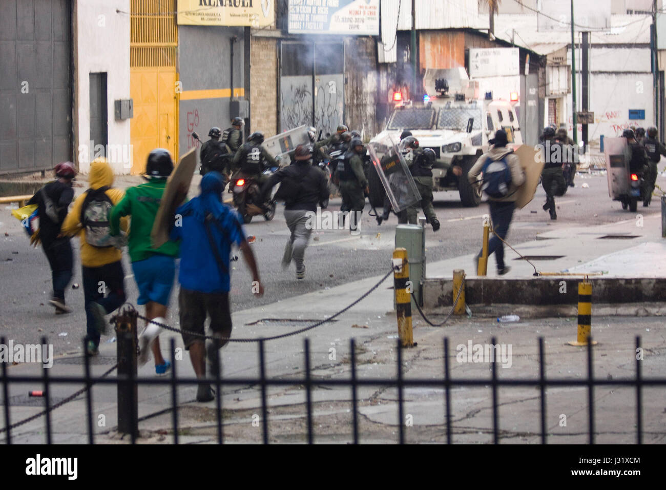 Caracas, Venezuela, 1st May, 2017. Members of the Bolivarian National Guard run away from a group of demonstrators during a protest against the government of Nicolas Maduro. Agustin Garcia/Alamy Live News Stock Photo