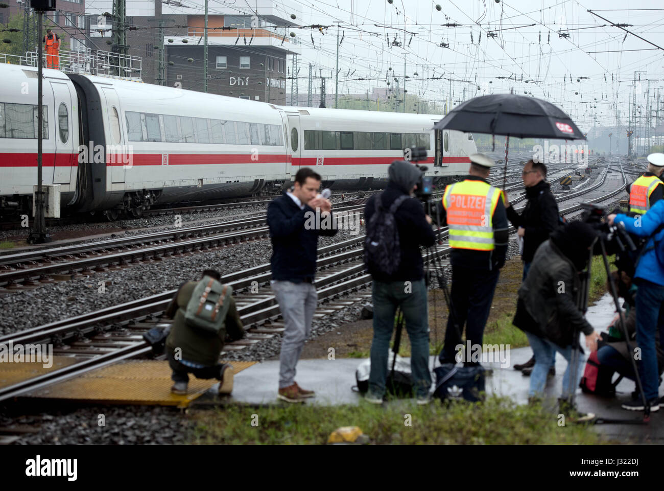 Dortmund, Germany. 2nd May, 2017. Journalists look on as a derailed
