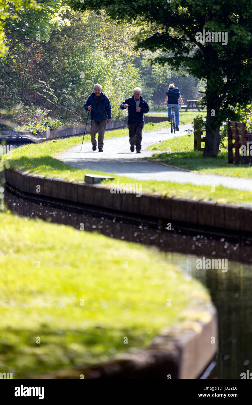 Walkers on a summers morning walking along the Llangollen Canal toepath