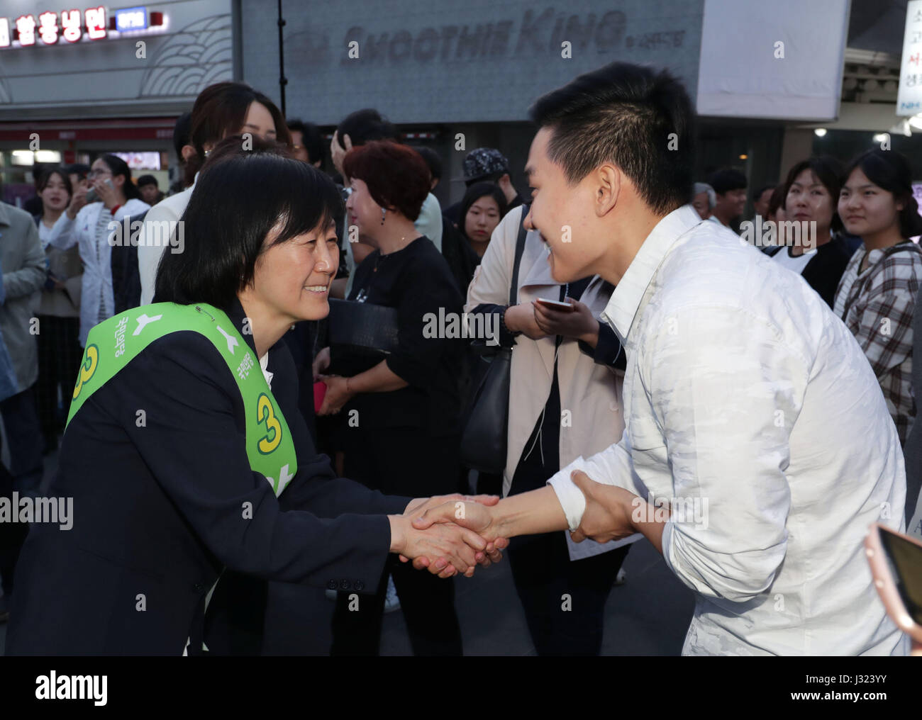 Seoul, Presidential election in Seoul. 2nd May, 2017. Kim Mi-kyung (L), wife of Ahn Cheol-soo, pesidential candidate of People's Party, shakes hands with supporters during a campaign for the upcoming Presidential election in Seoul, South Korea on May 2, 2017. South Korean presidential election will take place on May 9. Credit: Lee Sang-ho/Xinhua/Alamy Live News Stock Photo