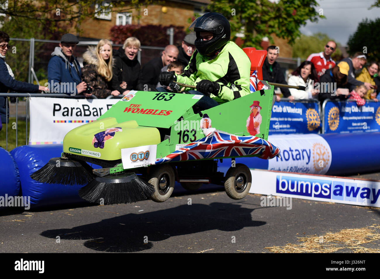 Soapbox, or soap box, derby carts leap over the jump ramps during an event in Billericay, Essex, UK. Home made race vehicles Stock Photo