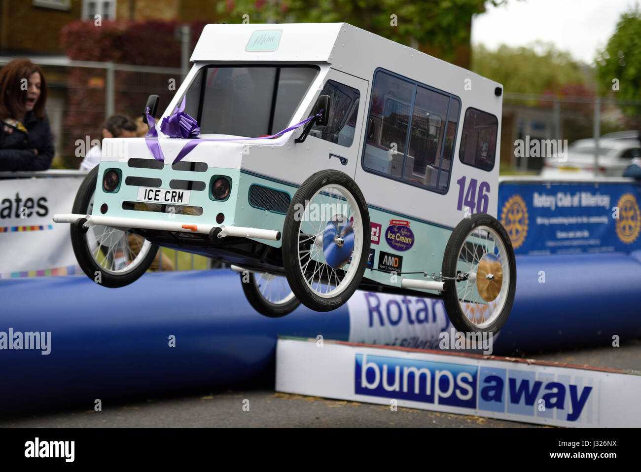 Soapbox, or soap box, derby carts leap over the jump ramps during an event in Billericay, Essex, UK. Home made race vehicles Stock Photo