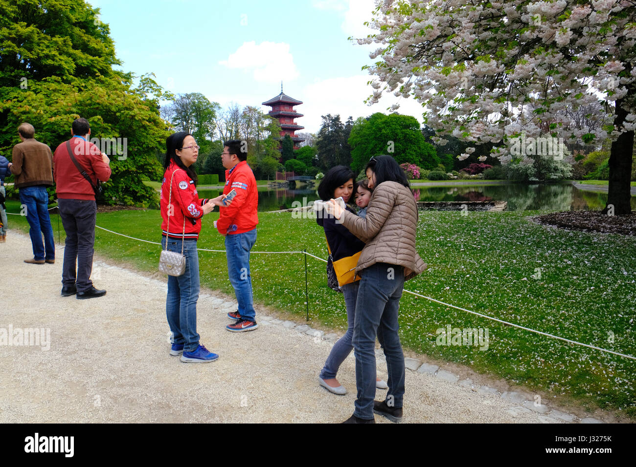 Asian tourists in the Royal Gardens of Laeken Stock Photo