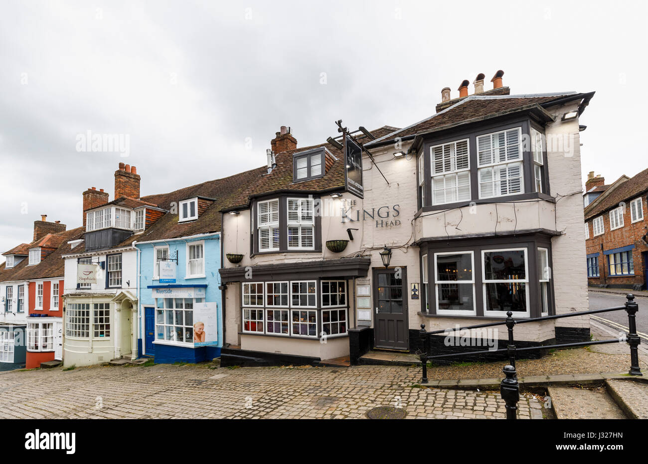 Cobbled Quay Hill with picturesque quaint local shops houses and Kings