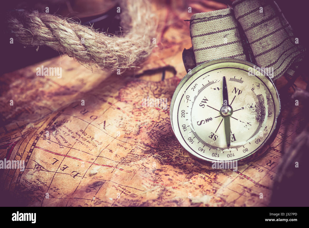 Columbus day and world map with compass Stock Photo - Alamy