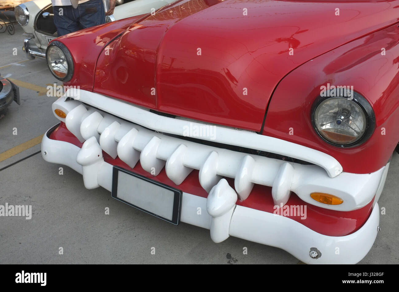 Beautiful retro Vintage red car with black headlamp and bumper Stock