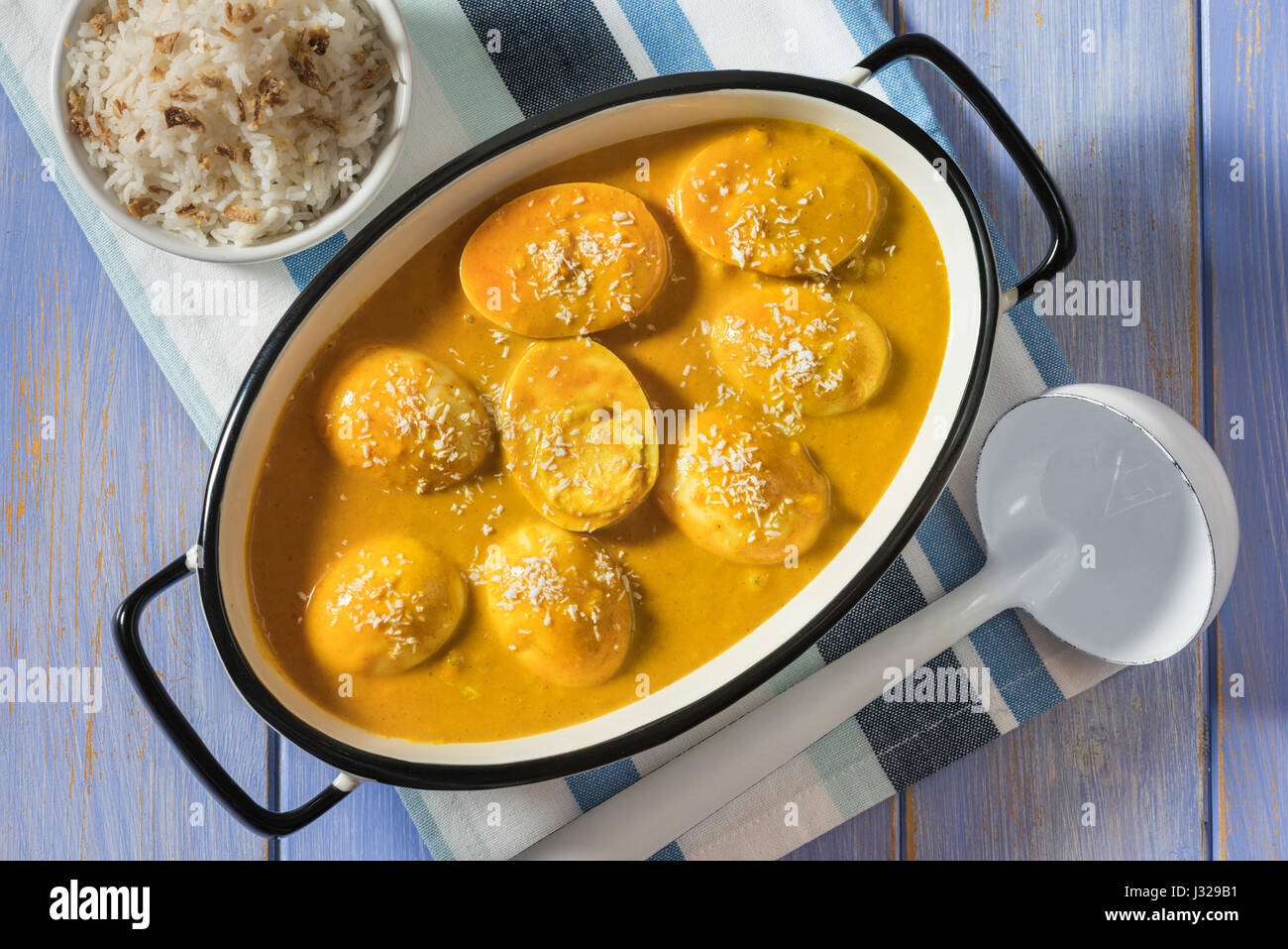 Curried eggs and rice Stock Photo