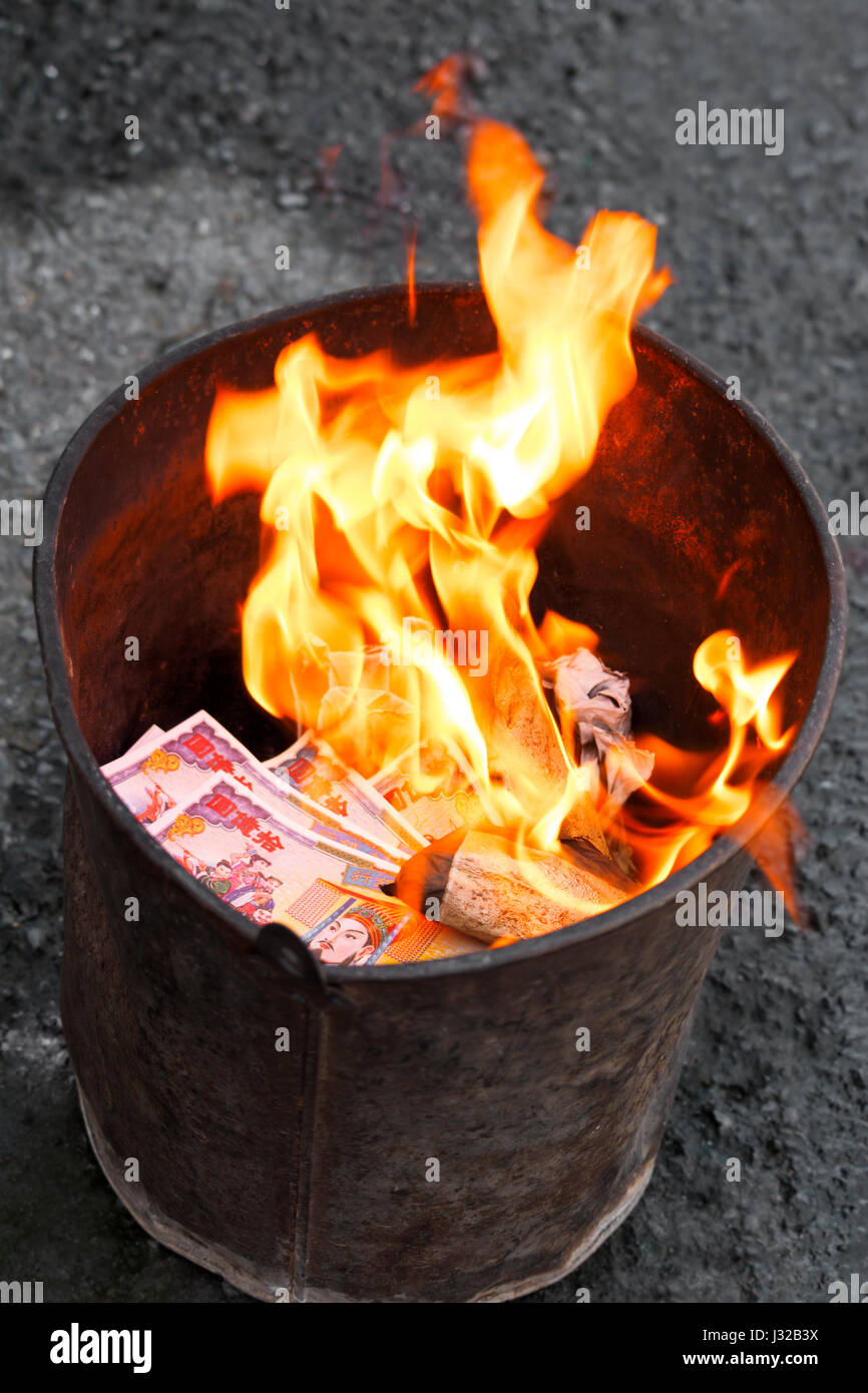 Chinese Joss Paper burning in flames Stock Photo