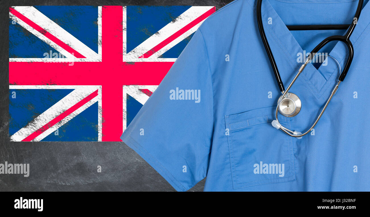 Doctors scrubs and stethoscope in front of Union Jack flag. NHS