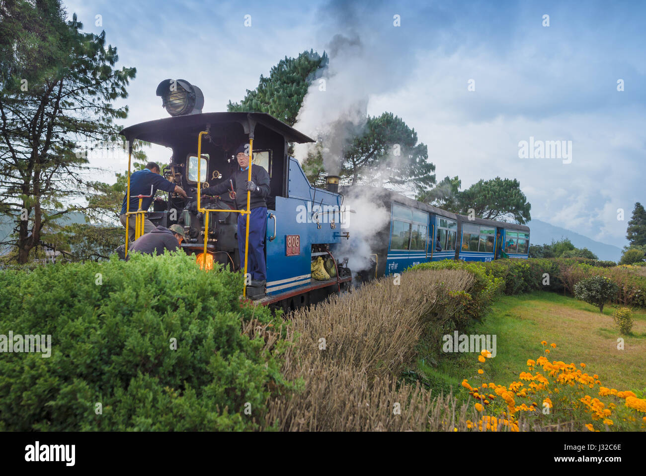 DARJEELING, INDIA – NOVEMBER 27, 2016: steam engine hauled DHR Toy Train has been operating on 2-foot gauge tracks since 1880s and gained the UNESCO W Stock Photo