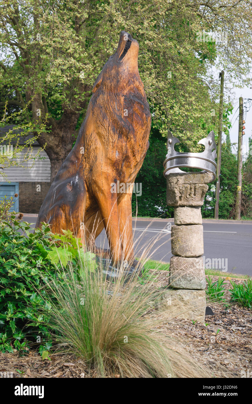 Wolf St Edmund, wooden sculpture of the legendary wolf that located the body of Anglo Saxon King Edmund, Bury St Edmunds, Suffolk, UK Stock Photo