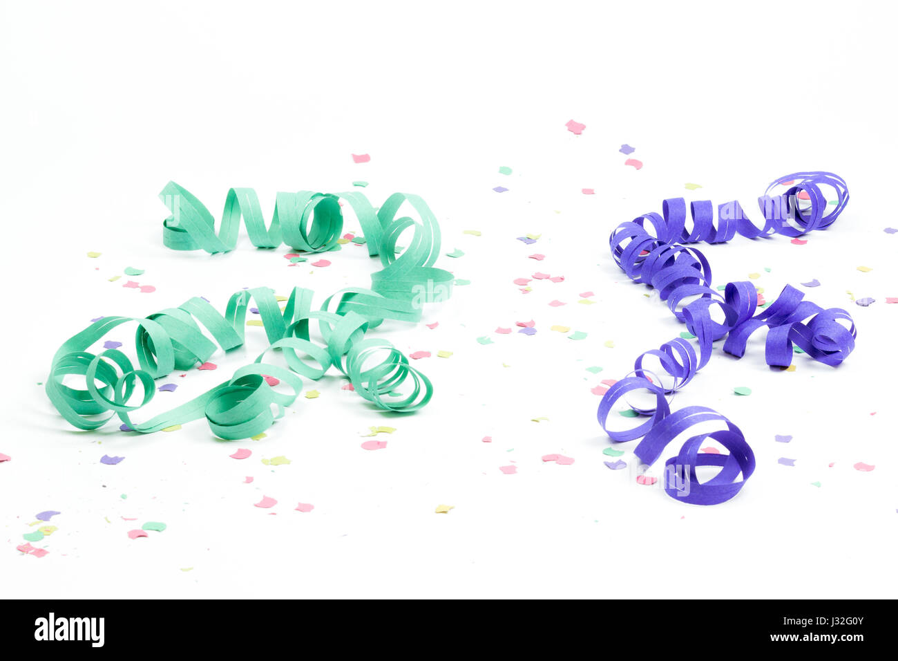 confetti and streamers on white background Stock Photo - Alamy