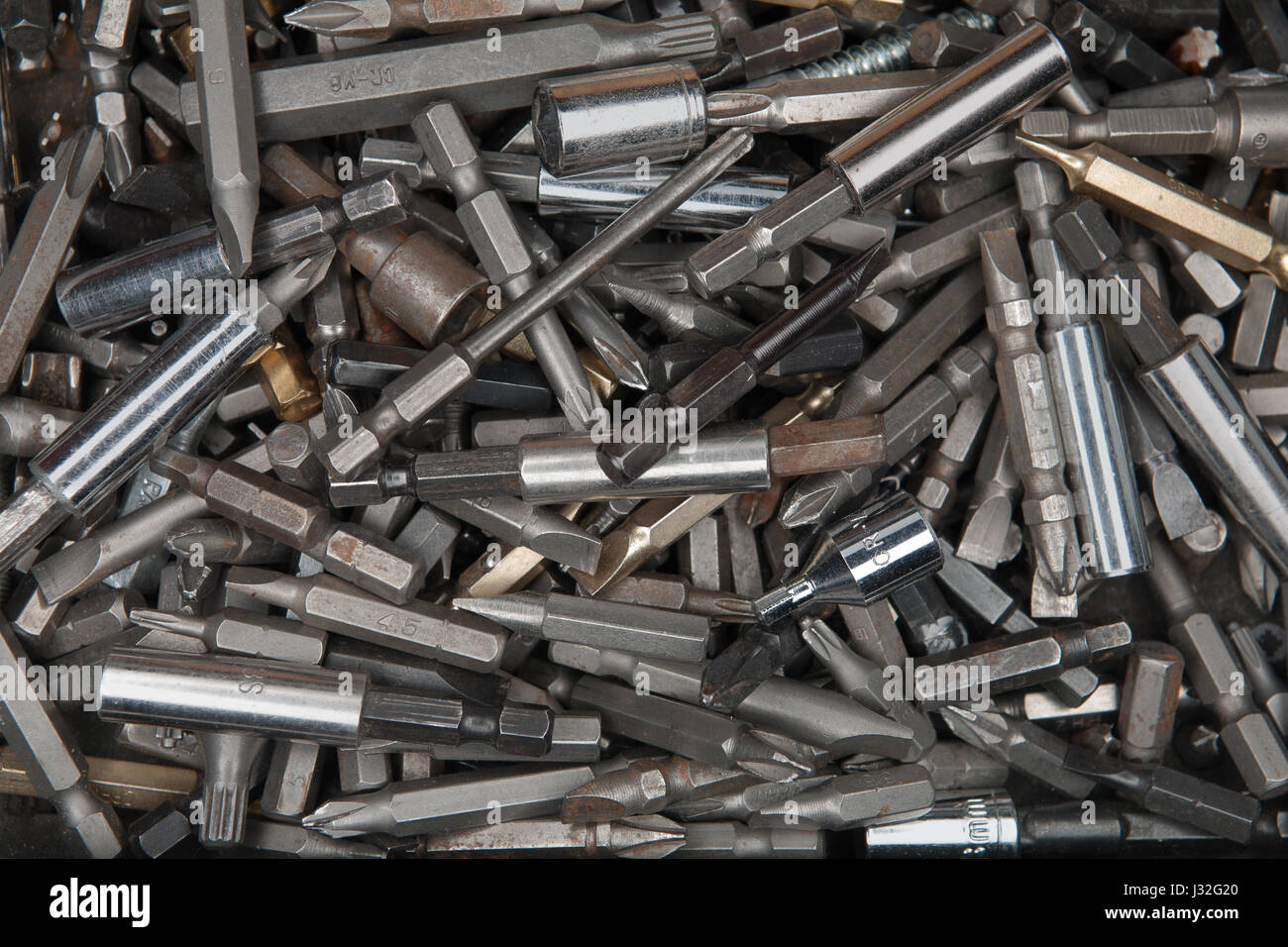 Macro of old rusty used screwdriver bits in a box Stock Photo Alamy