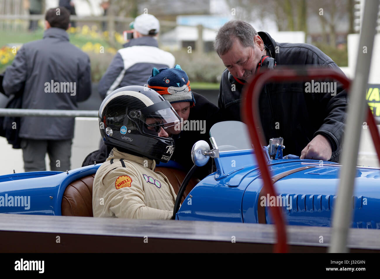 Ross Keeling's 1936 Delahaye 135MS requiring some attention from his pit crew during the 75th Goodwood Members Meeting Stock Photo