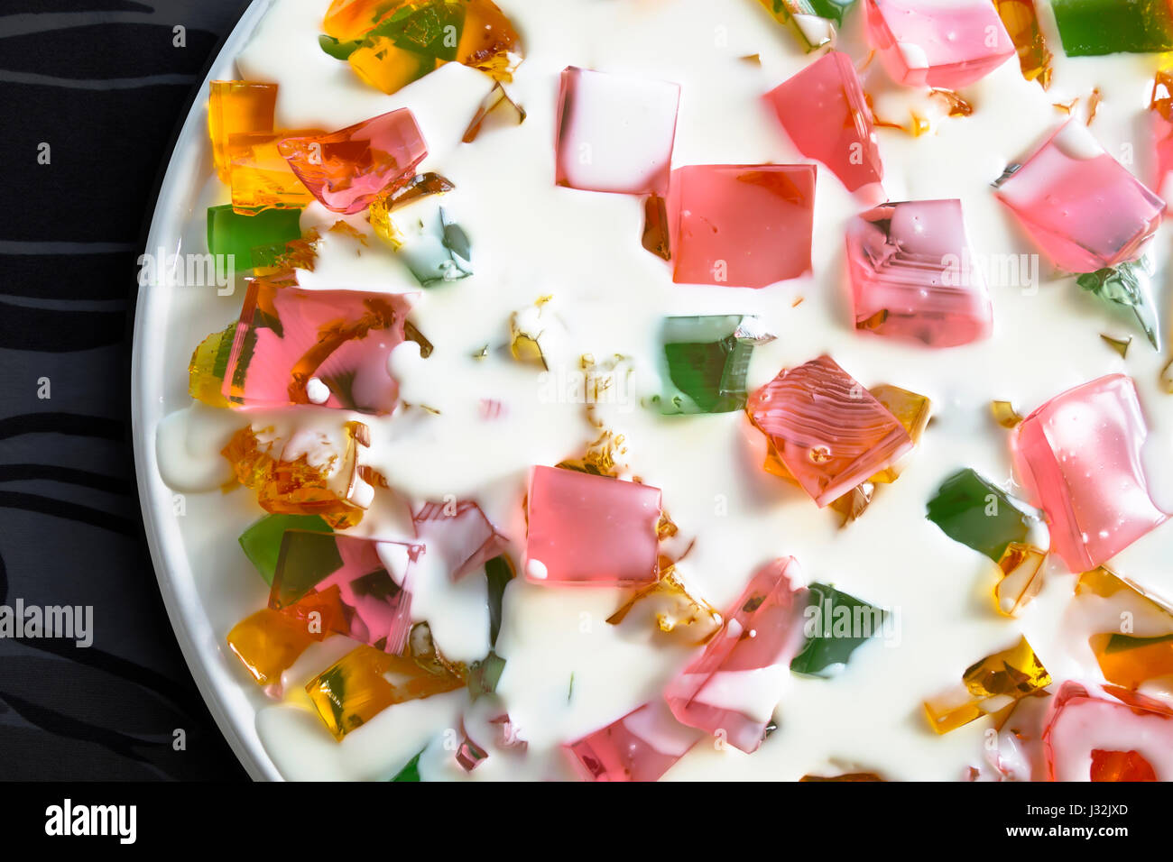 Colorful transparent dietary sweet pieces of pastel jelly from gelatin