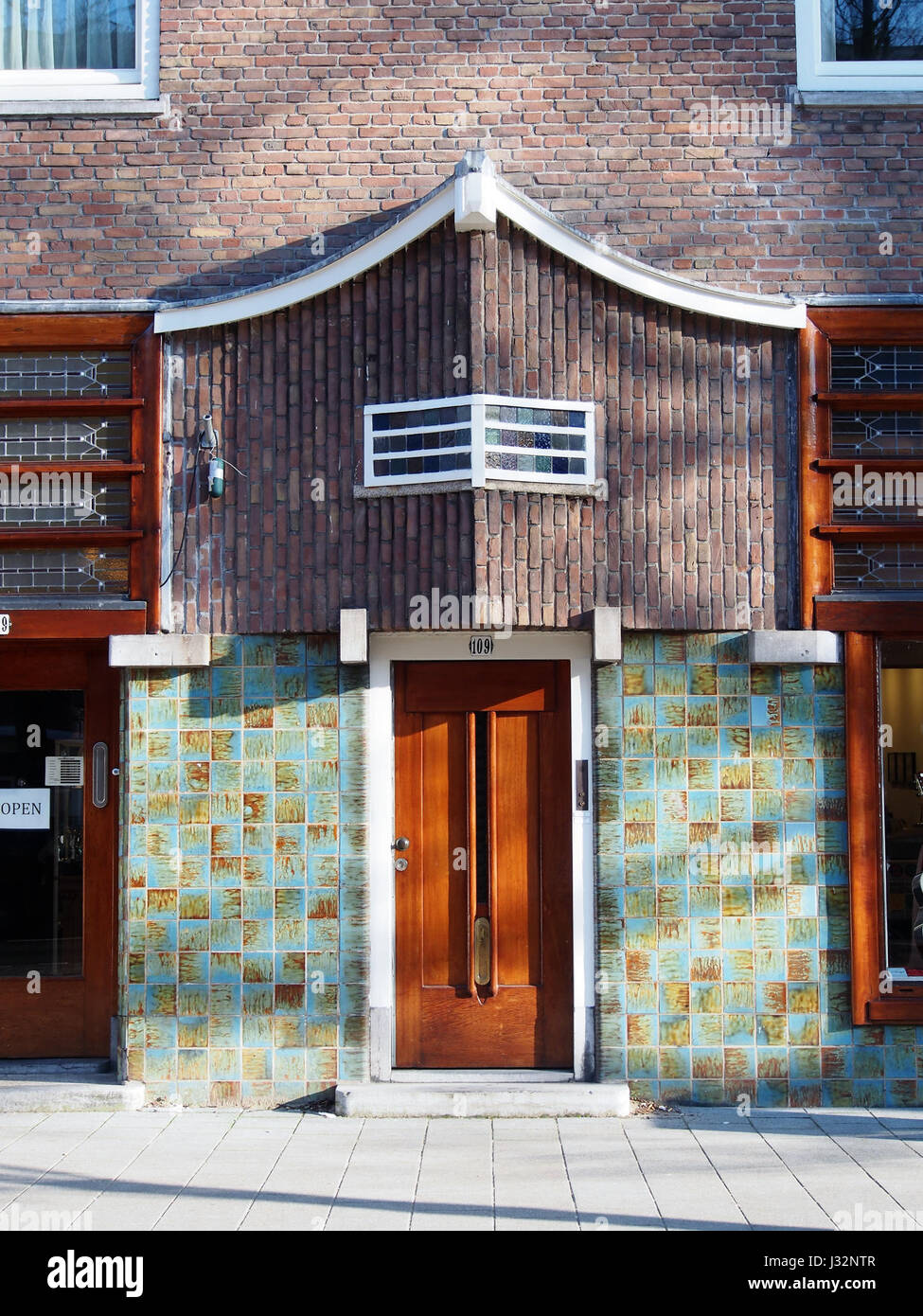 This image captures the portal of Rijnstraat 109, showcasing the architectural design and detailing of the building's entrance. The structure features classical elements and decorative finishes. Stock Photo