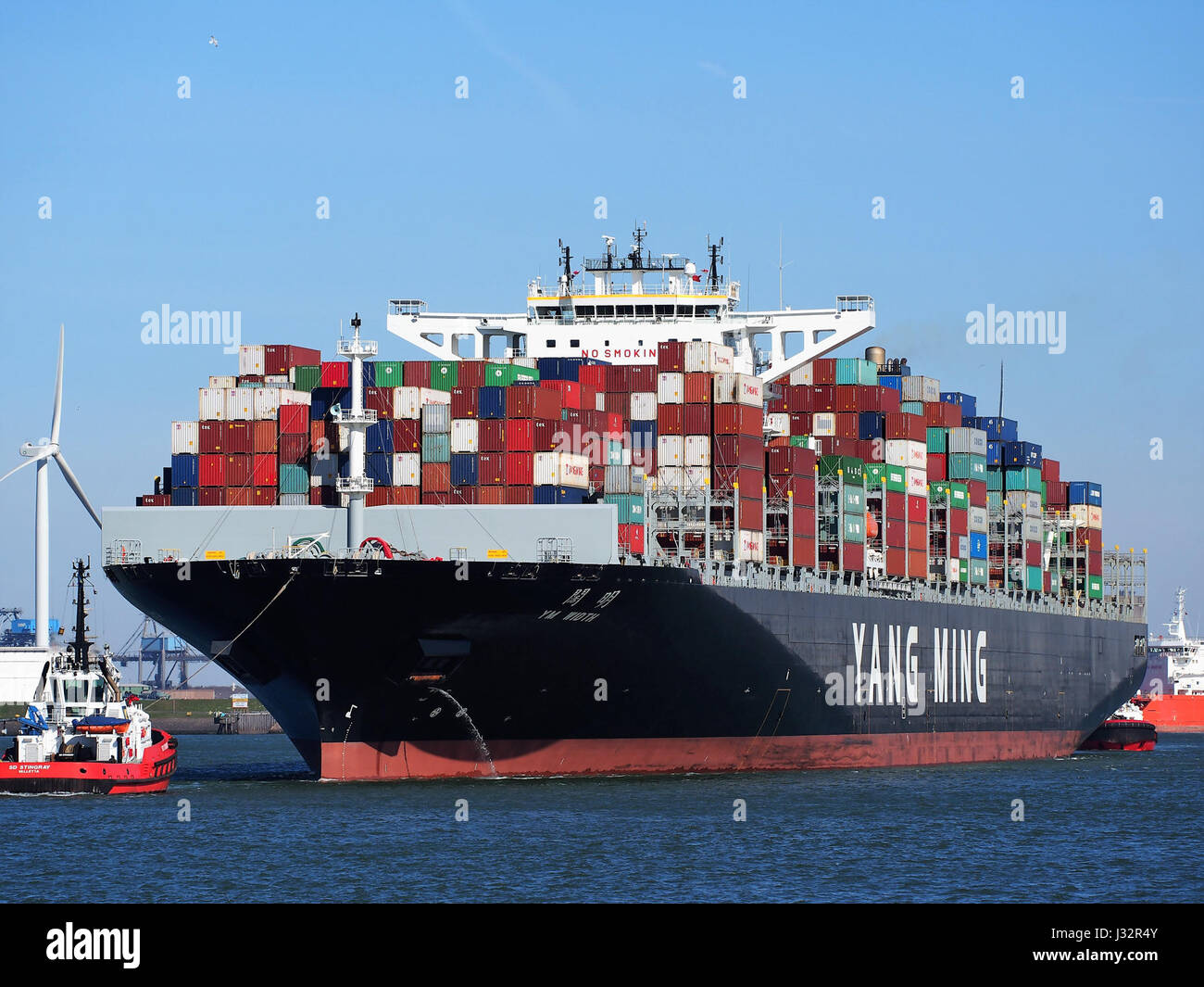The YM Width is a container ship that arrived at the Port of Rotterdam in 2016. It is part of global shipping operations, playing a key role in international trade and logistics. Stock Photo