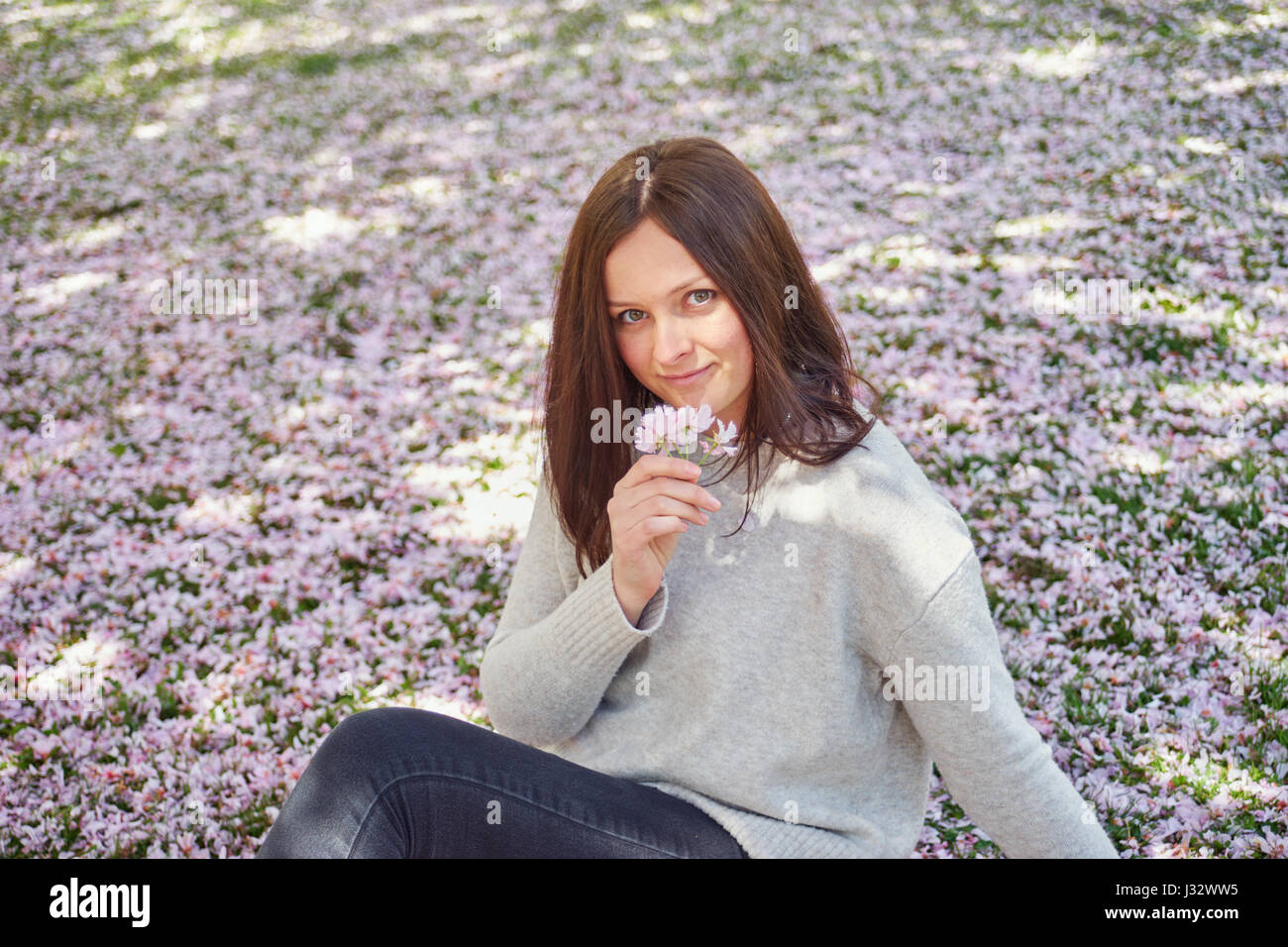 A woman in a spring park Stock Photo - Alamy