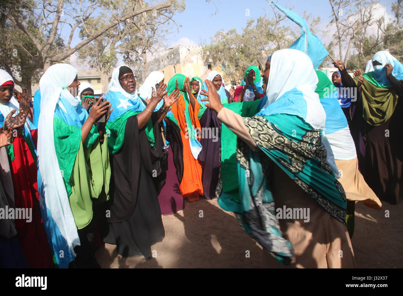 Residents of Kismayo, Somalia attend celebrations to mark International Women's Day on March 8, 2017. AMISOM Photo / Awil Abukar Stock Photo